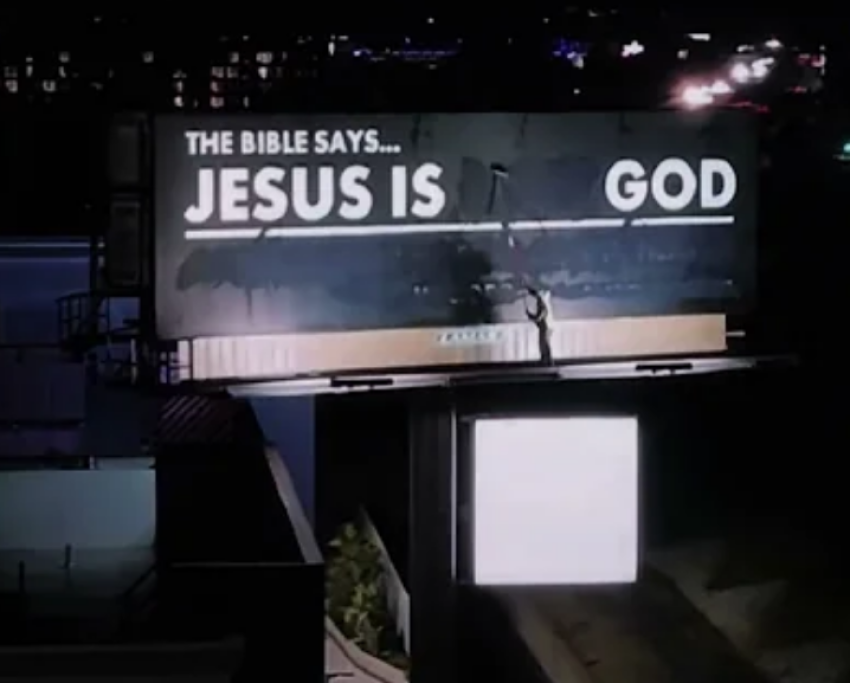 Man paints over heretical billboard to read 'Jesus is God' in viral video